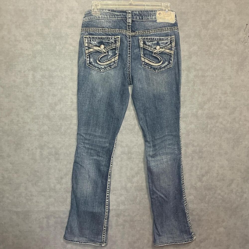 Silver distressed boot cut jeans